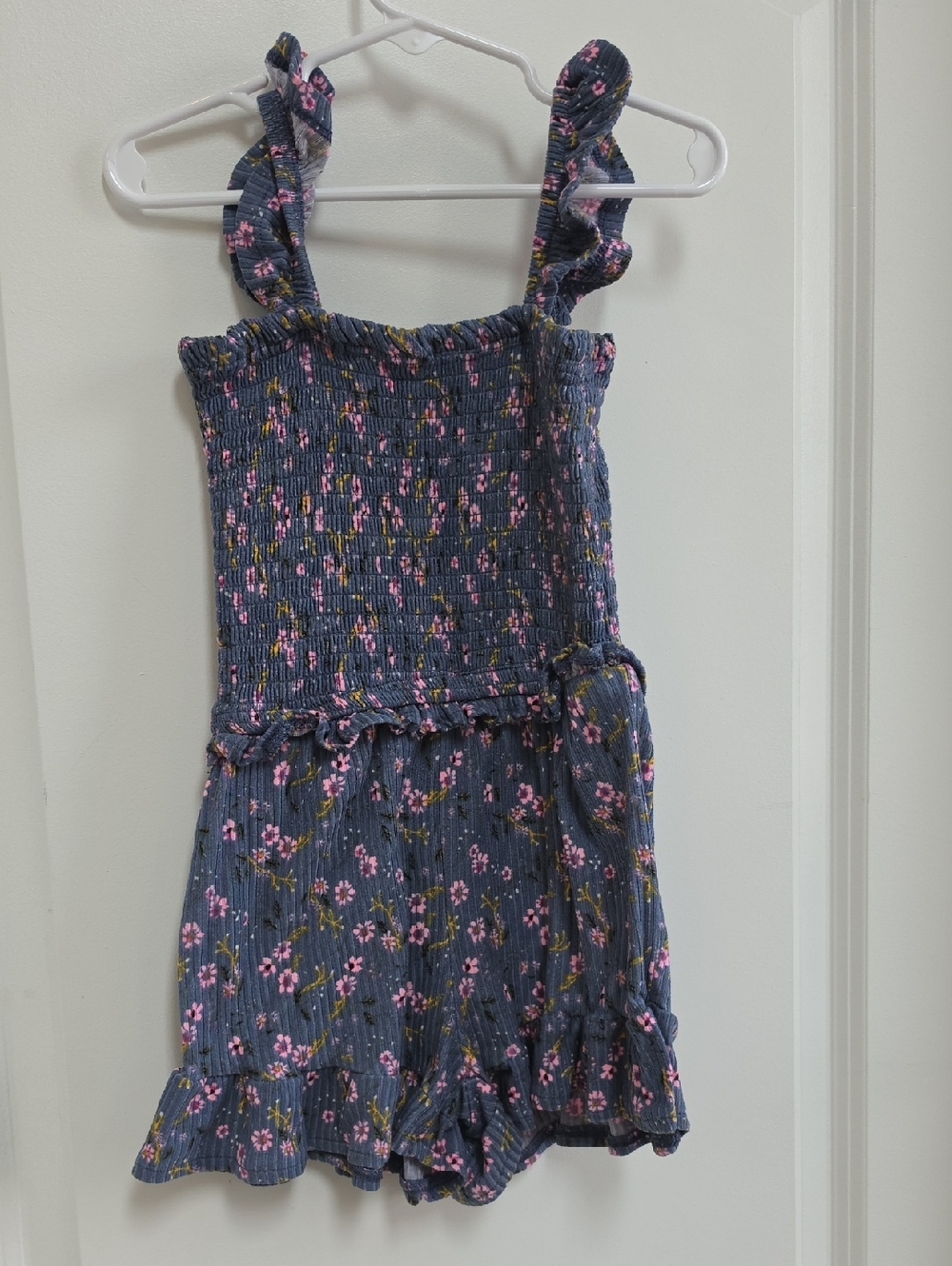 Smocked Floral Ruffle Romper in Navy Blue